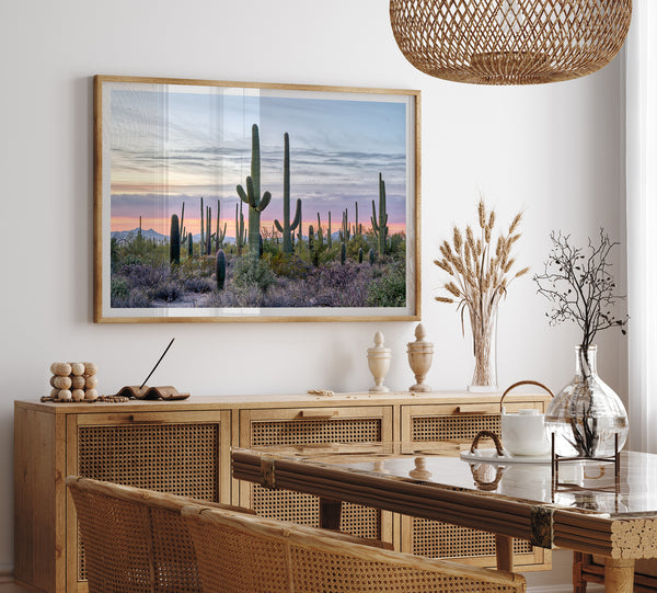 Cactus art print of saguaro cacti at sunset with pastel sky over desert landscape.