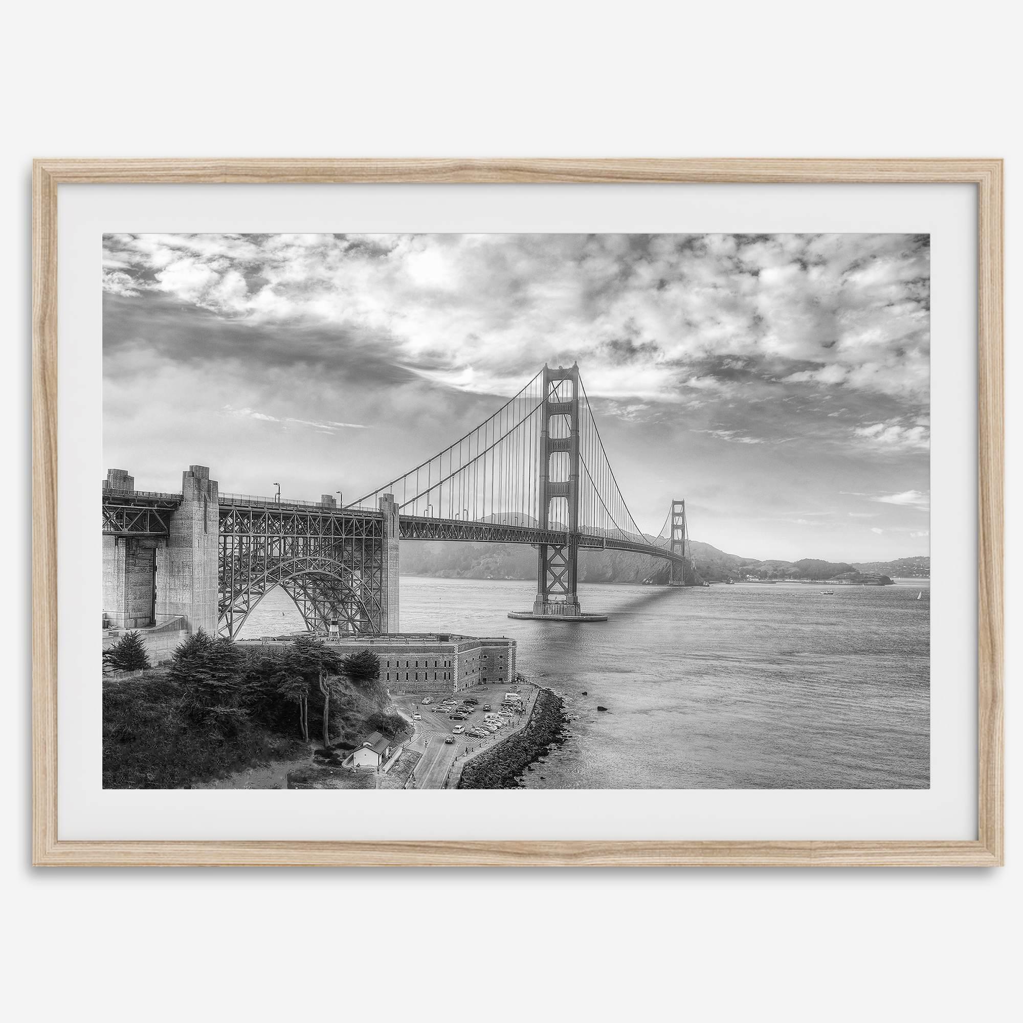 Golden Gate Bridge Wall Art in black-and-white HDR photography with dramatic clouds and water reflections.