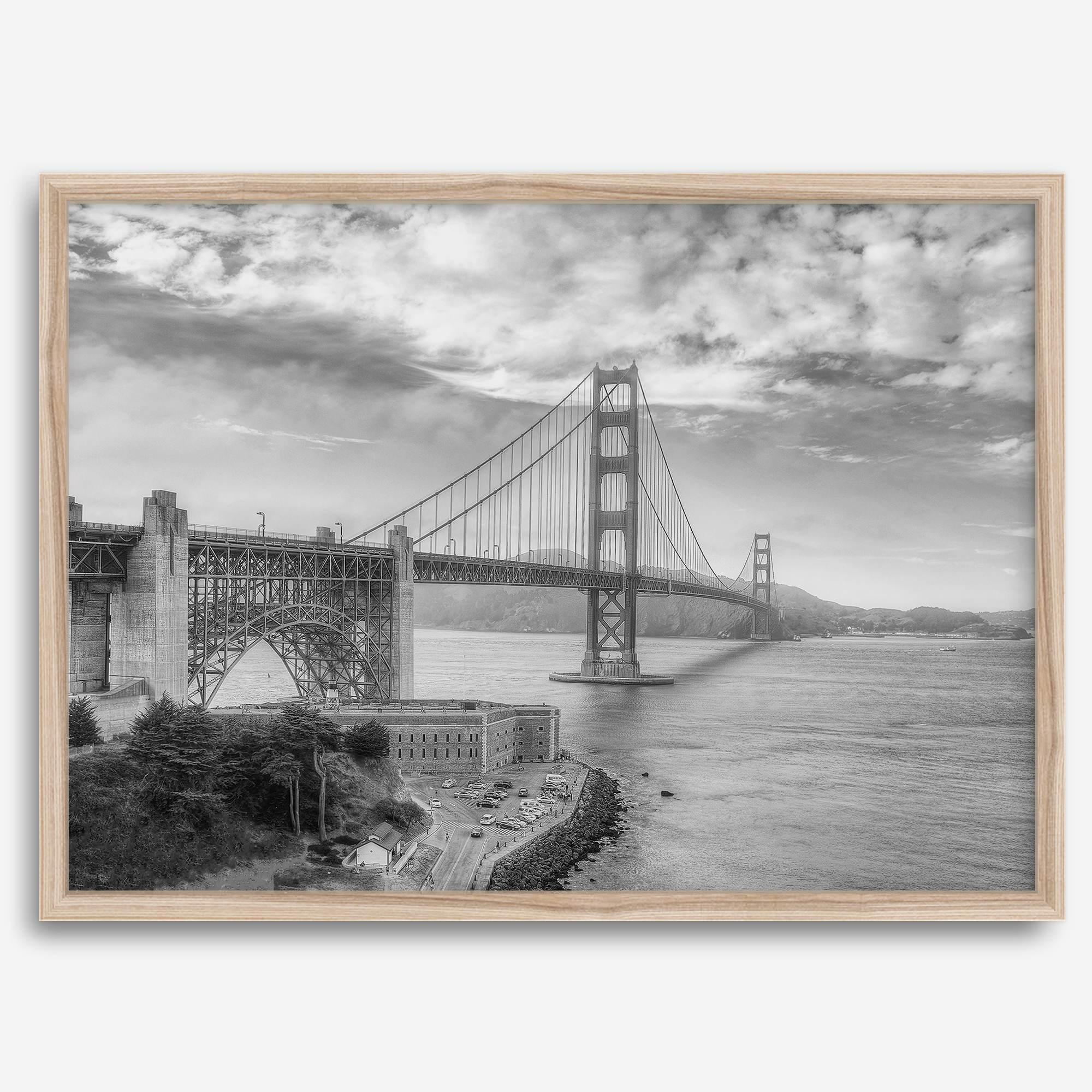 Golden Gate Bridge Wall Art in black-and-white HDR photography with dramatic clouds and water reflections.