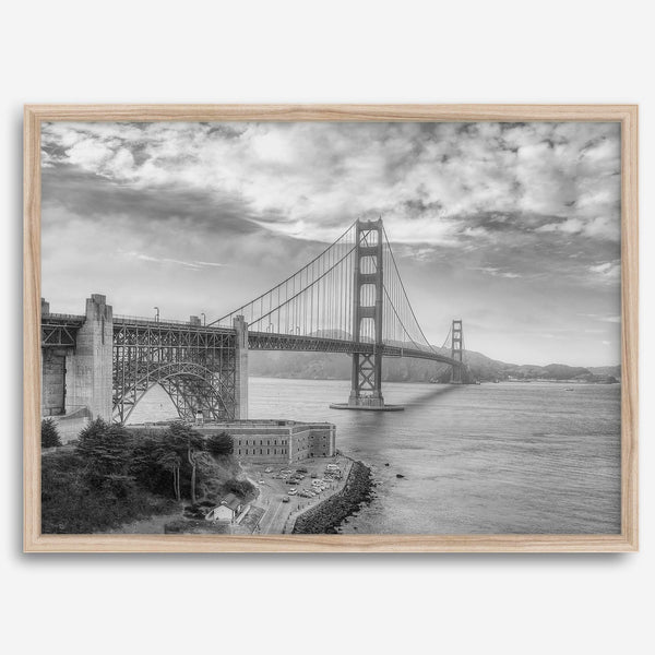 Golden Gate Bridge Wall Art in black-and-white HDR photography with dramatic clouds and water reflections.