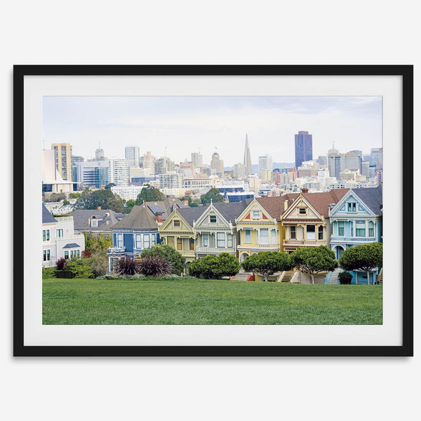 A fine art framed print of the famous colorful painted Ladies Victorian houses in Alamo Square, San Francisco.
