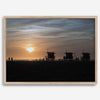 Step into Venice Beach with our fine art beach sunset framed or unframed print. The print showcases the beach in sunset with the silhouettes of the famous lifeguard towers and people in the sunset.