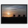 Step into Venice Beach with our fine art beach sunset framed or unframed print. The print showcases the beach in sunset with the silhouettes of the famous lifeguard towers and people in the sunset.