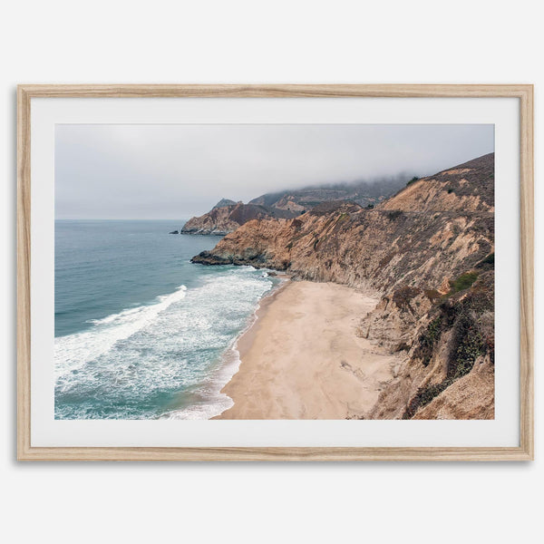 California beach wall art featuring Gray Whale Cove Beach with sandy shores, rugged cliffs, and misty Pacific Ocean waves.
