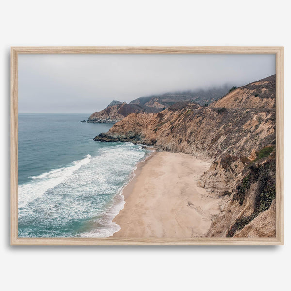 California beach wall art featuring Gray Whale Cove Beach with sandy shores, rugged cliffs, and misty Pacific Ocean waves.