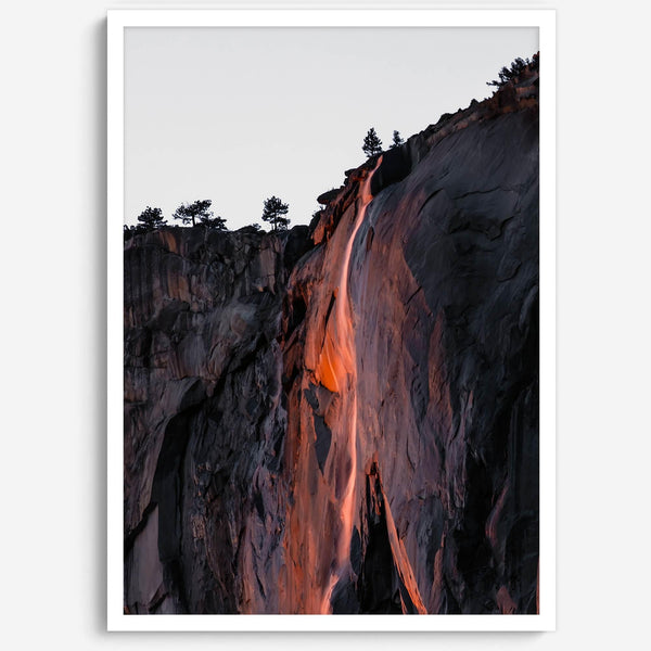 This premium photography framed or unframed fine poster print of Yosemite National Park Firefall - a rare phenomenon where Horsetail Falls in Yosemite seems to be flowing with fire rather than water.