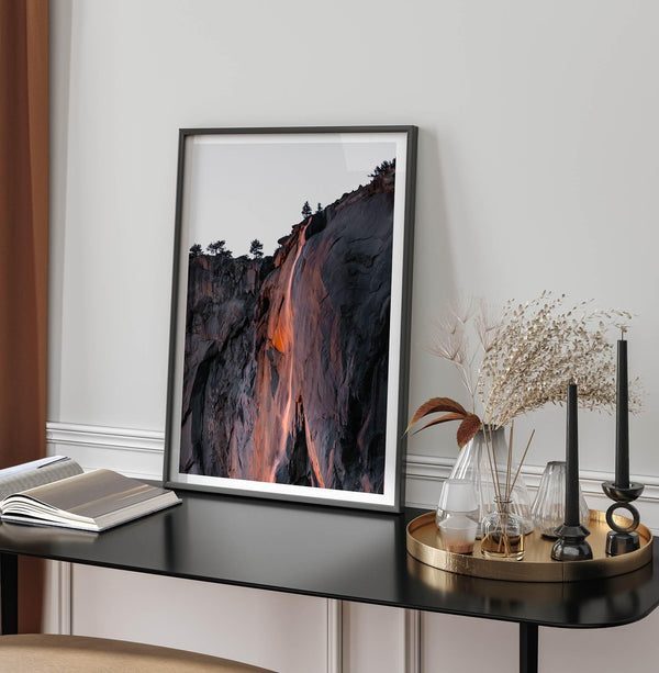 This premium photography framed or unframed fine poster print of Yosemite National Park Firefall - a rare phenomenon where Horsetail Falls in Yosemite seems to be flowing with fire rather than water.