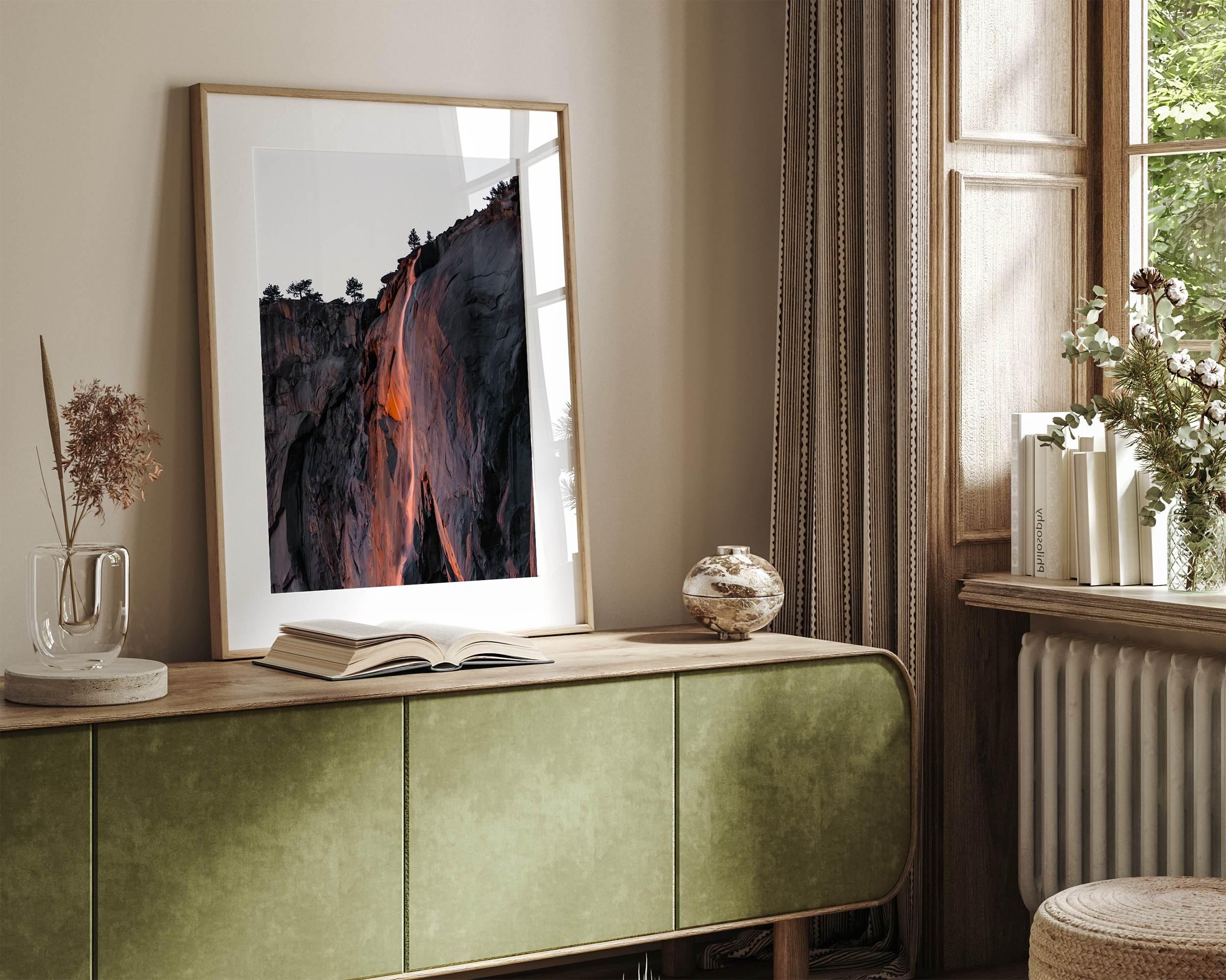 This premium photography framed or unframed fine poster print of Yosemite National Park Firefall - a rare phenomenon where Horsetail Falls in Yosemite seems to be flowing with fire rather than water.