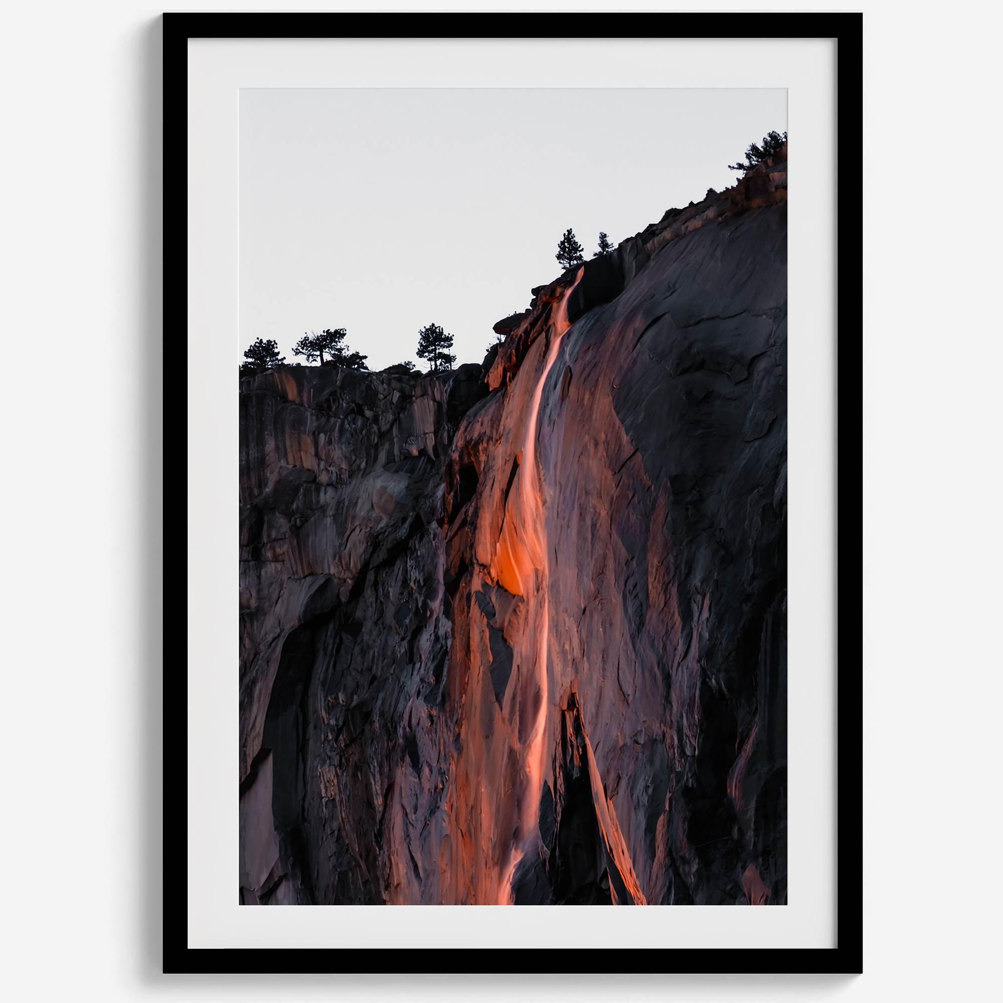This premium photography framed or unframed fine poster print of Yosemite National Park Firefall - a rare phenomenon where Horsetail Falls in Yosemite seems to be flowing with fire rather than water.