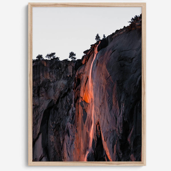 This premium photography framed or unframed fine poster print of Yosemite National Park Firefall - a rare phenomenon where Horsetail Falls in Yosemite seems to be flowing with fire rather than water.