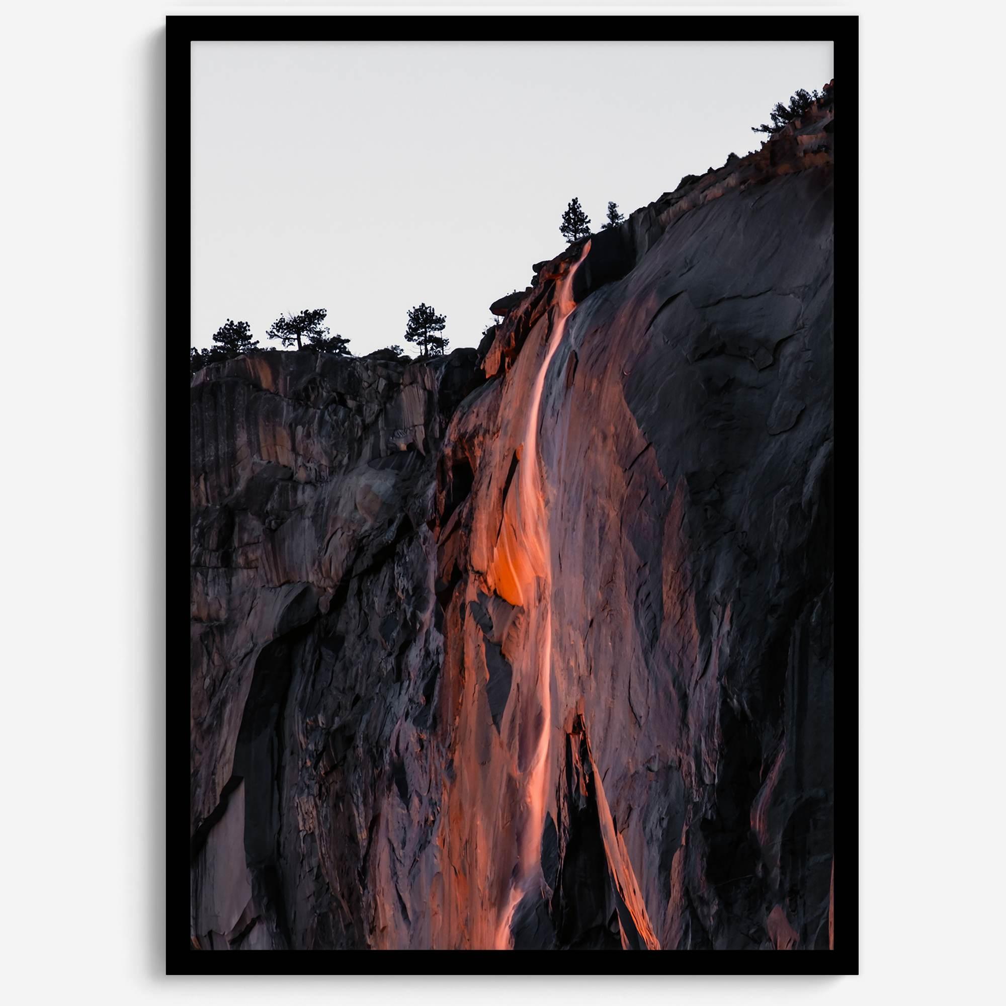 This premium photography framed or unframed fine poster print of Yosemite National Park Firefall - a rare phenomenon where Horsetail Falls in Yosemite seems to be flowing with fire rather than water.