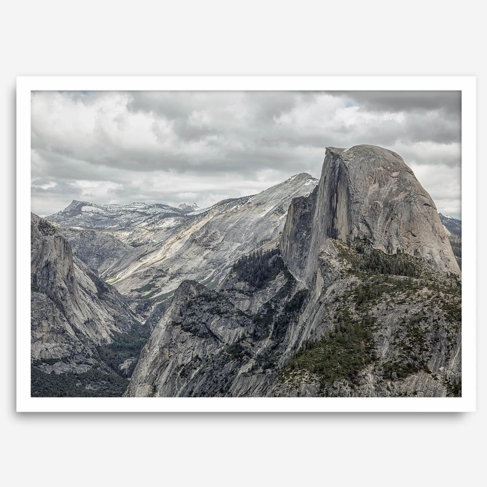 A fine art framed or unframed print showcasing the stunning half-dome mountain in Yosemite national park. The picture was shot an edited as an HDR photograph adding more depth to this beautiful mountain wall art.