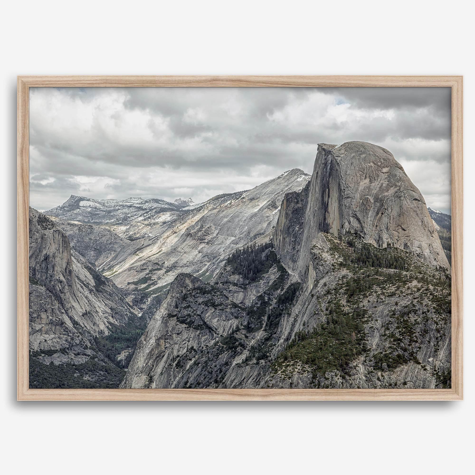 A fine art framed or unframed print showcasing the stunning half-dome mountain in Yosemite national park. The picture was shot an edited as an HDR photograph adding more depth to this beautiful mountain wall art.