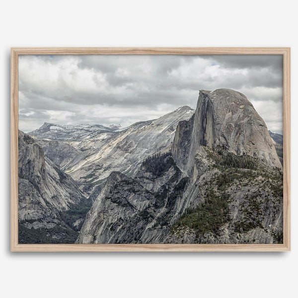 A fine art framed or unframed print showcasing the stunning half-dome mountain in Yosemite national park. The picture was shot an edited as an HDR photograph adding more depth to this beautiful mountain wall art.