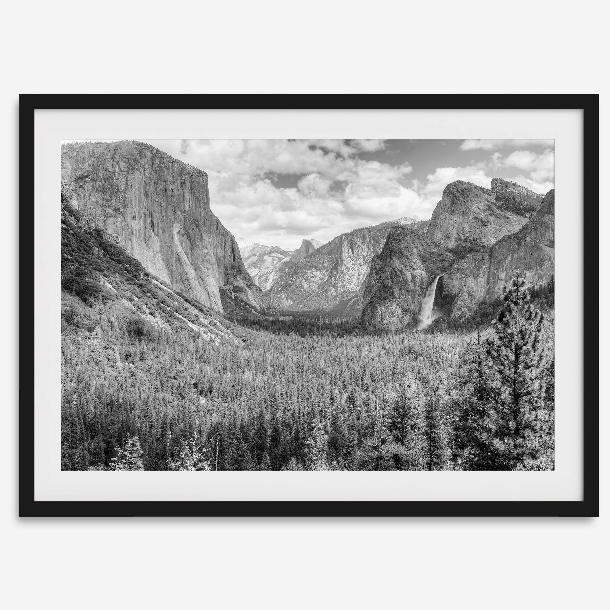 A breathtaking fine art black and white print of Yosemite valley during spring when the waterfalls are in full power.