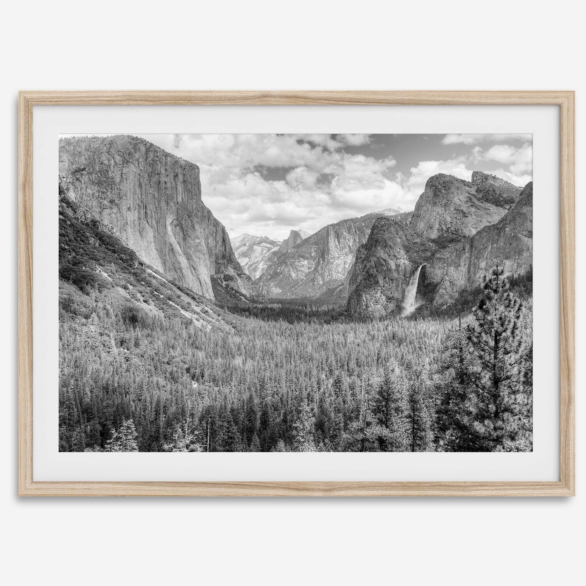 A breathtaking fine art black and white print of Yosemite valley during spring when the waterfalls are in full power.