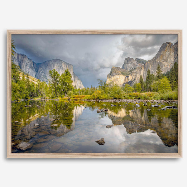 A stunning framed large Yosemite National Park print that shows the breathtaking valley at sunset with its mountains, rivers, forests, and waterfalls. A truly mesmerizing landscape that is as perfect as your wall decor as it is a special gift.