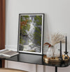 Black and white minimalist fine art print of Yosemite National Park. Sunlight filters through green leaves, revealing a hint of a cascading waterfall.