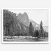 Black and white fine art print of Yosemite National Park in winter with snow-covered trees and granite cliffs.