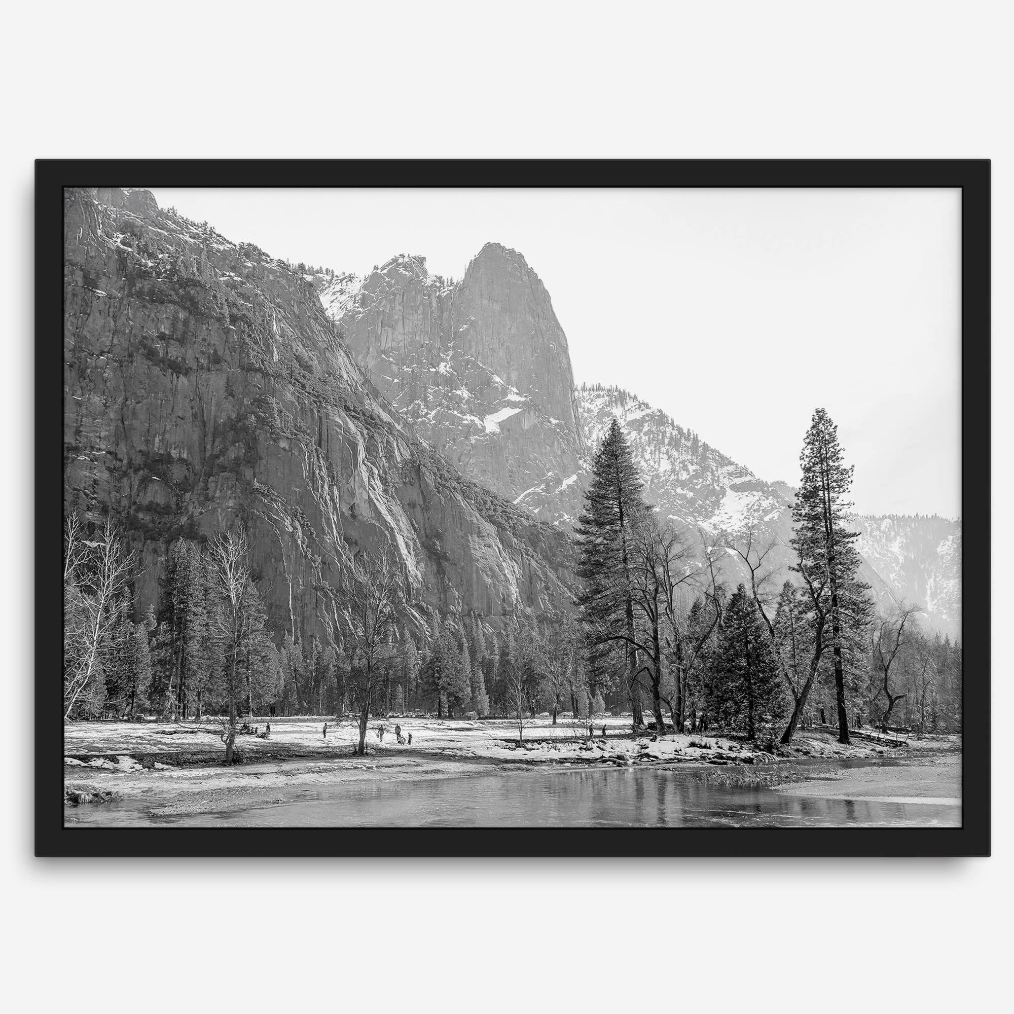 Black and white fine art print of Yosemite National Park in winter with snow-covered trees and granite cliffs.