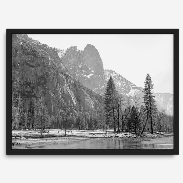 Black and white fine art print of Yosemite National Park in winter with snow-covered trees and granite cliffs.