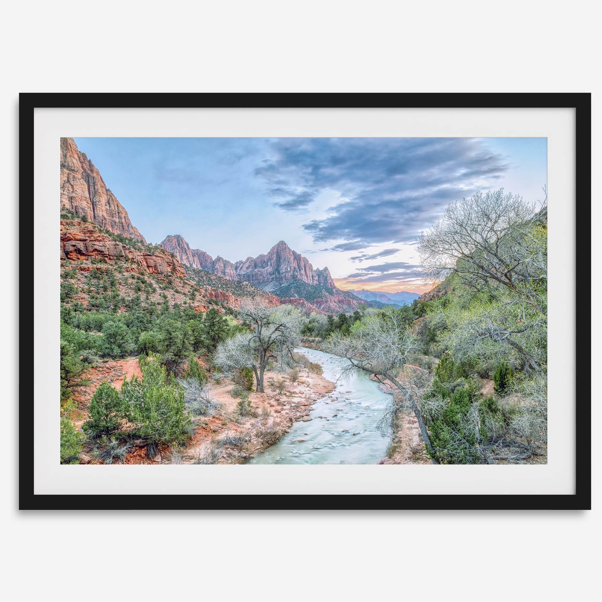 A framed fine art landscape photography print of Zion National Park showing a beautiful river, trees, and desert landscape with the backdrop of Zion mountain range. This Utah wall art is perfect for nature photography and desert art enthusiasts.