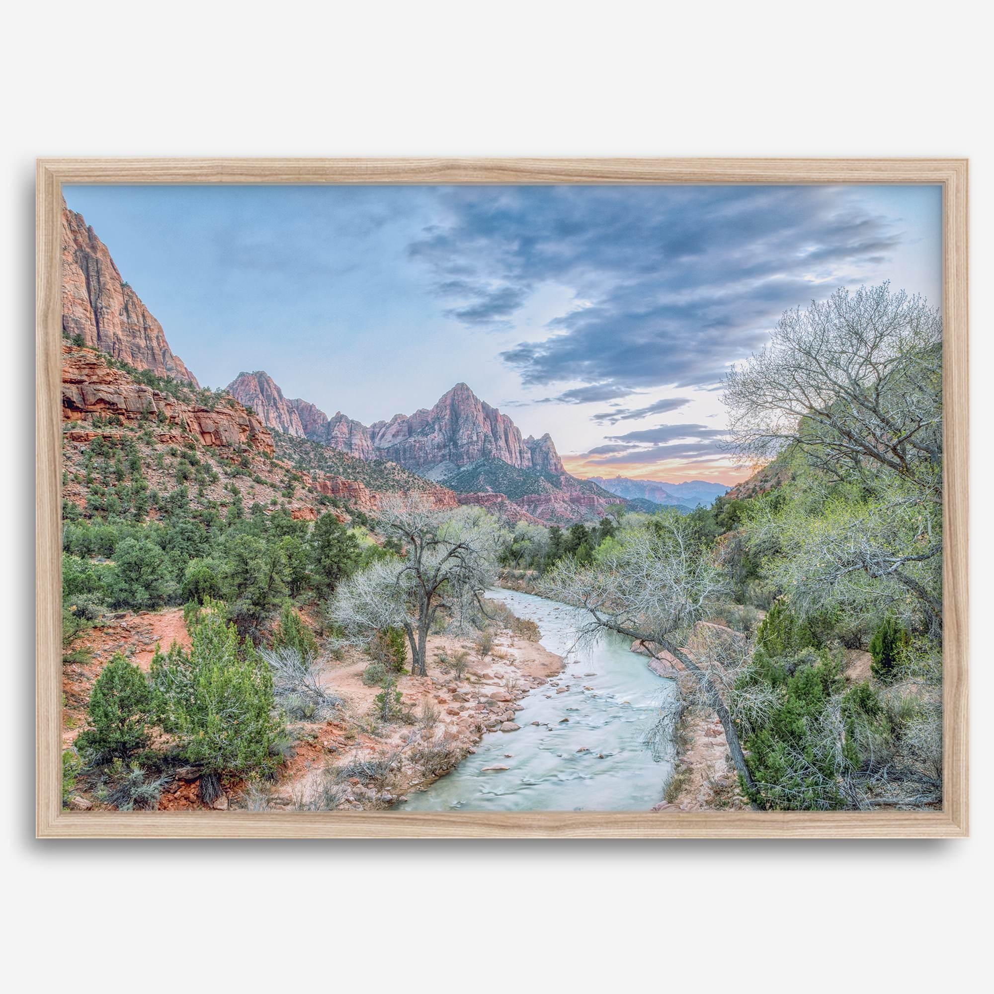 A framed fine art landscape photography print of Zion National Park showing a beautiful river, trees, and desert landscape with the backdrop of Zion mountain range. This Utah wall art is perfect for nature photography and desert art enthusiasts.