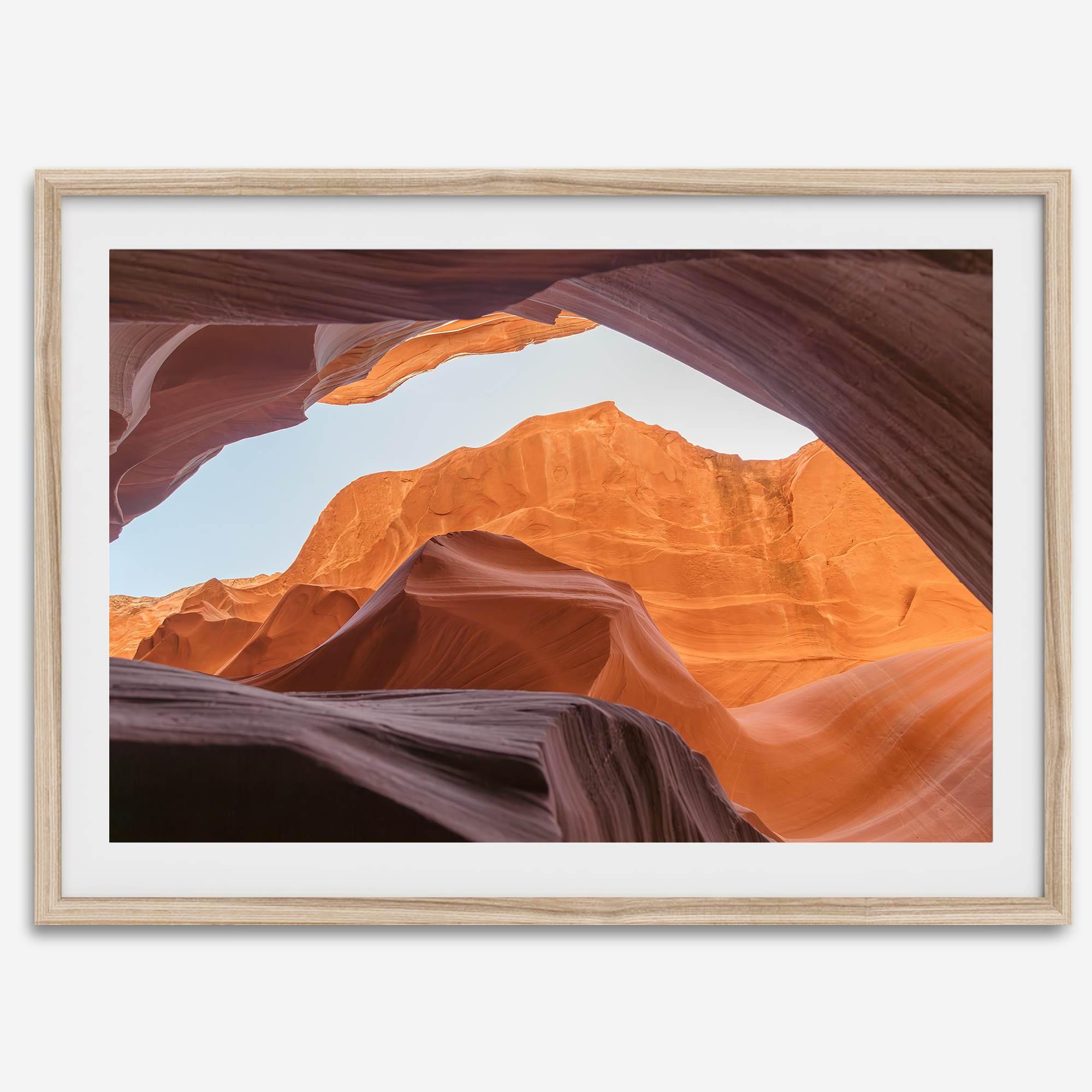 Framed fine art print of Antelope Canyon in Arizona, showcasing layered desert rock formations with rich colors and smooth textures.