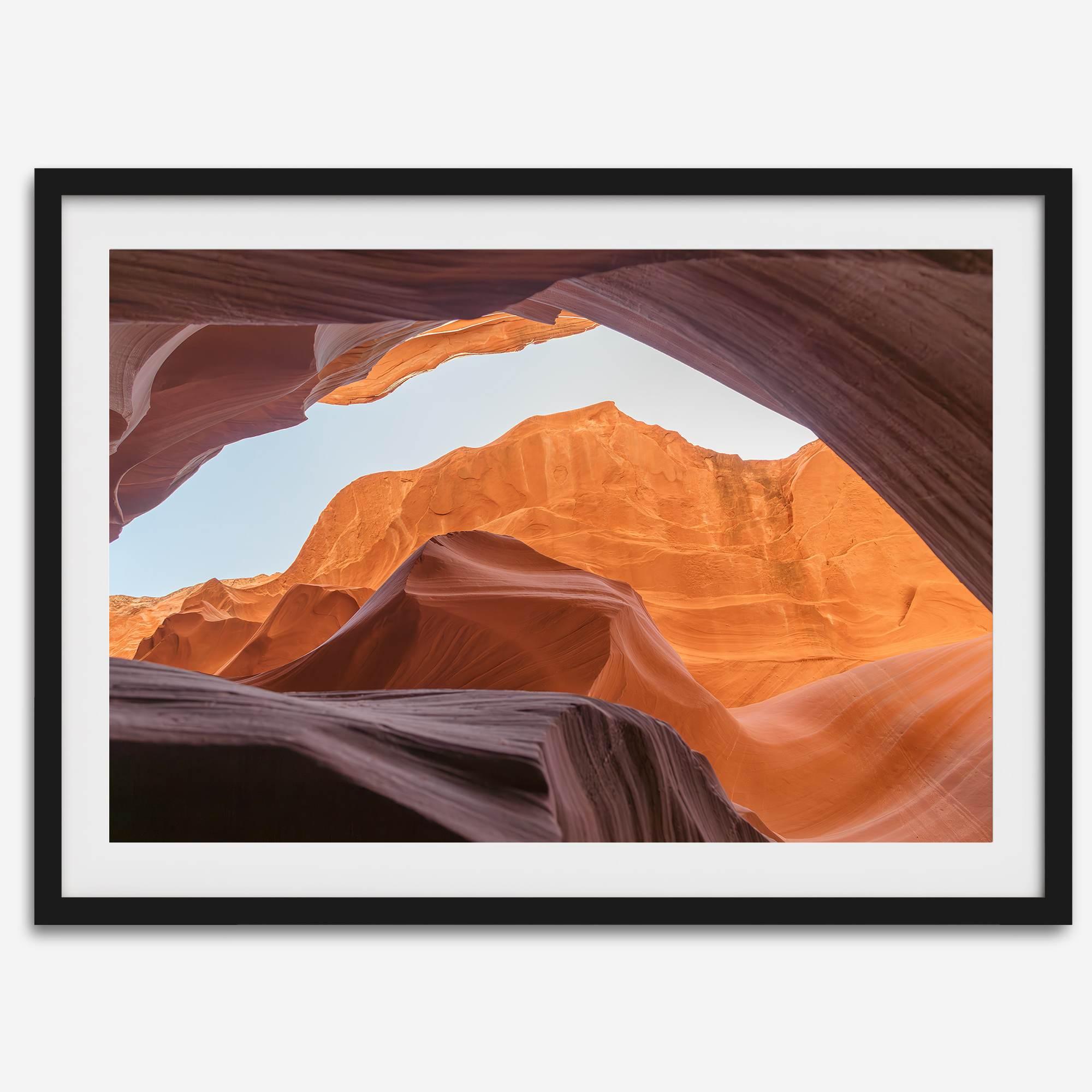 Framed fine art print of Antelope Canyon in Arizona, showcasing layered desert rock formations with rich colors and smooth textures.