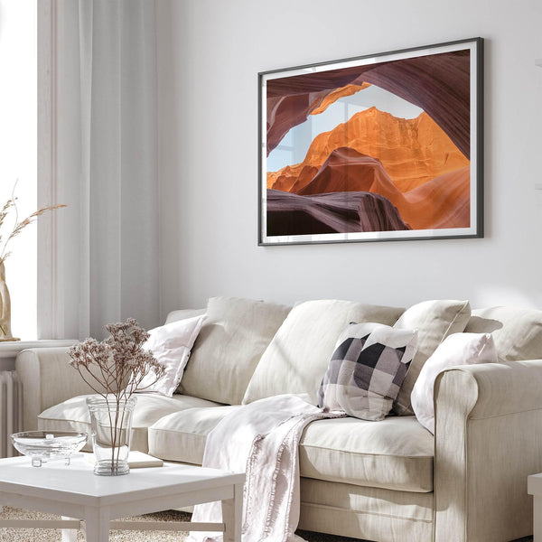 Framed fine art print of Antelope Canyon in Arizona, showcasing layered desert rock formations with rich colors and smooth textures.