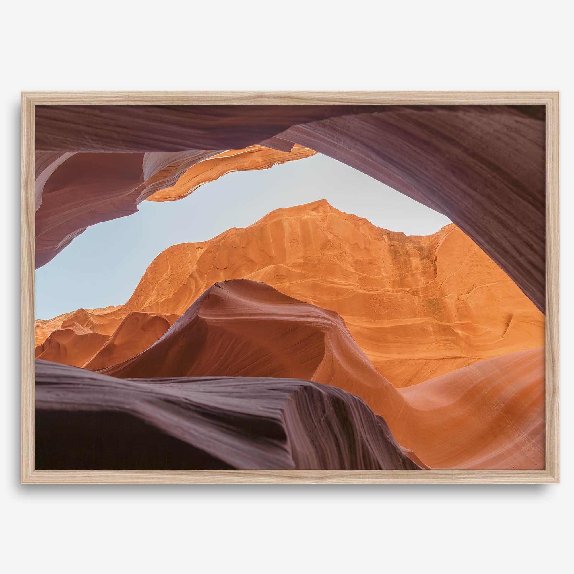 Framed fine art print of Antelope Canyon in Arizona, showcasing layered desert rock formations with rich colors and smooth textures.