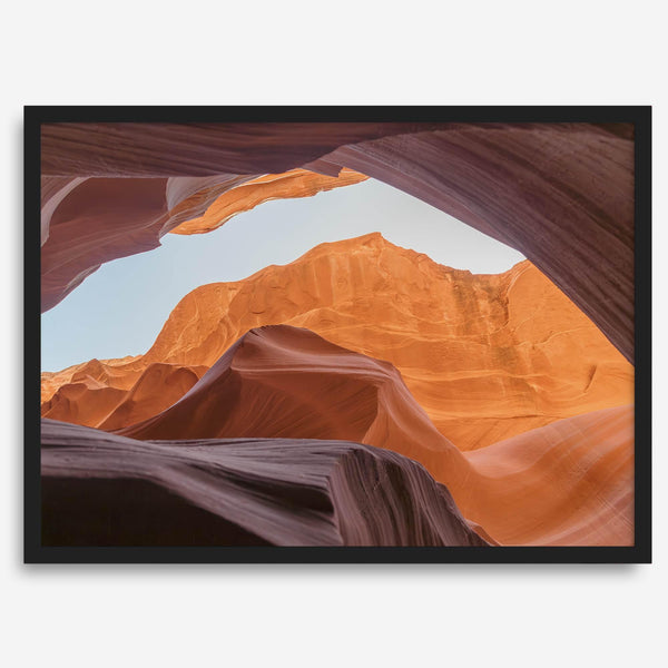Framed fine art print of Antelope Canyon in Arizona, showcasing layered desert rock formations with rich colors and smooth textures.
