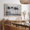 Black and white Hanalei Beach wall art featuring four palm trees with a coastal Kauai backdrop.