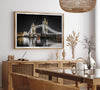 Night view of London’s Tower Bridge with glowing lights and water reflections, perfect london wall art print