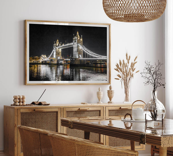 Night view of London’s Tower Bridge with glowing lights and water reflections, perfect london wall art print