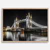 Night view of London’s Tower Bridge with glowing lights and water reflections, perfect london wall art print