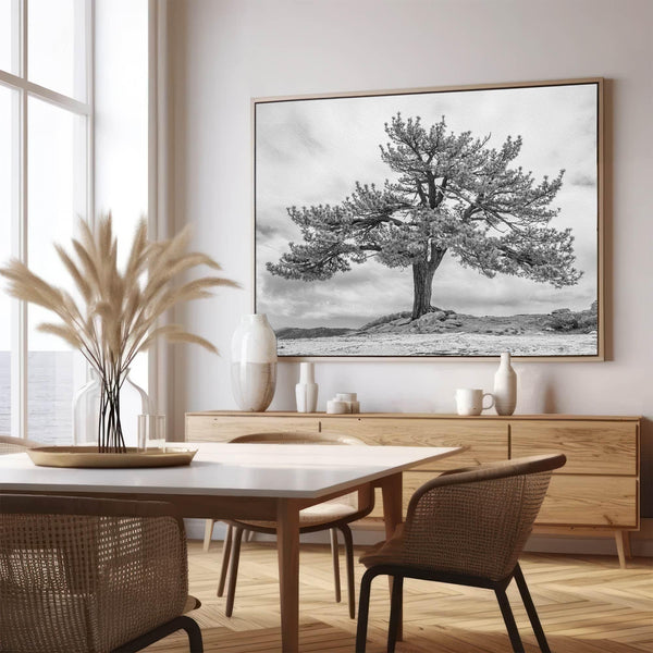 Close-up of black and white canvas texture showing detailed tree branches in scenic mountain setting.