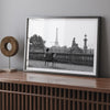 Black-and-white Paris wall art featuring a woman reading in a park with the Eiffel Tower in the background.