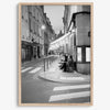 Paris street photography showing glowing café at dusk on Rue de l’Université in black and white.