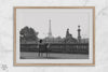 Black-and-white Paris wall art featuring a woman reading in a park with the Eiffel Tower in the background.
