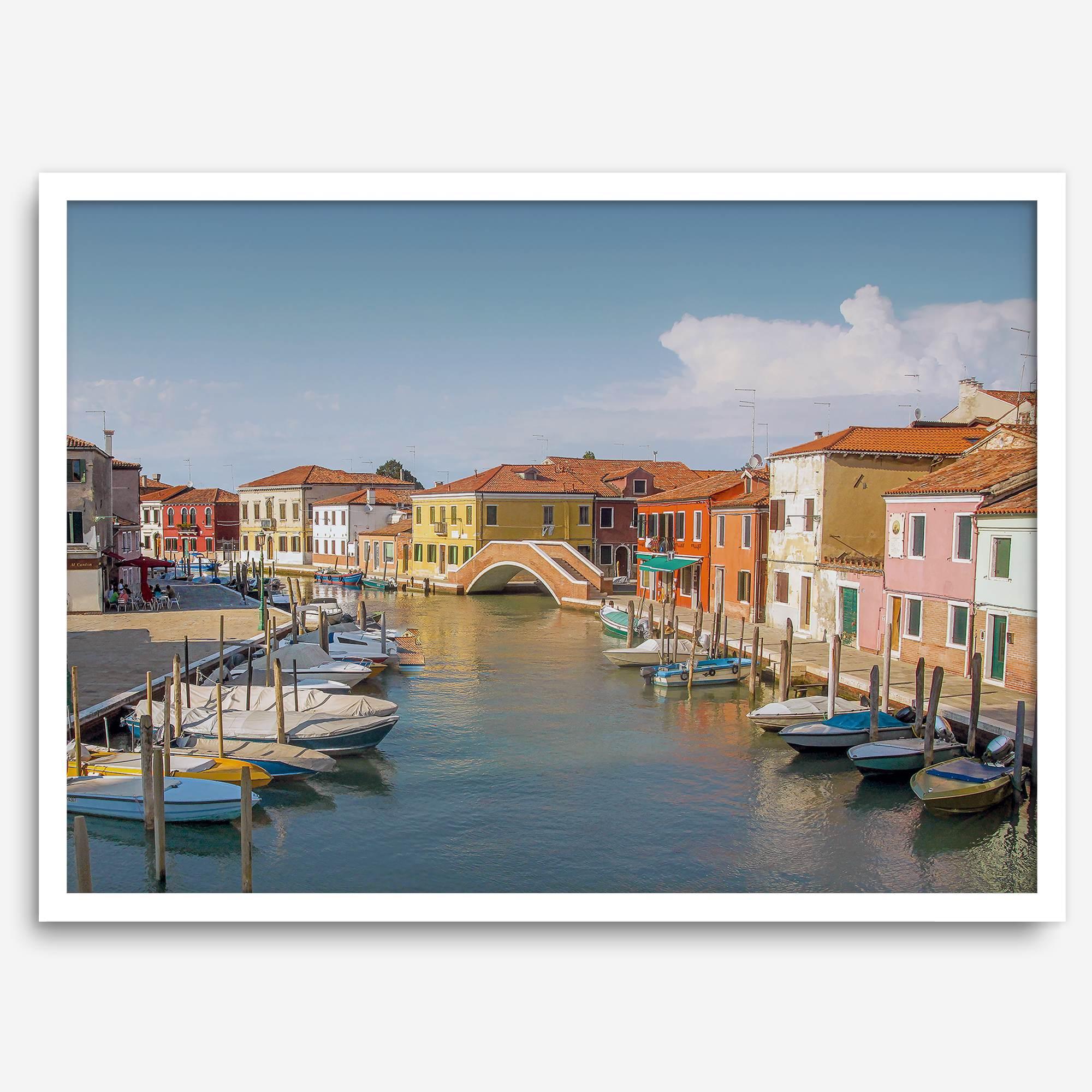 Colorful Murano Venice wall art featuring boats, bridge, and painted homes along the water.