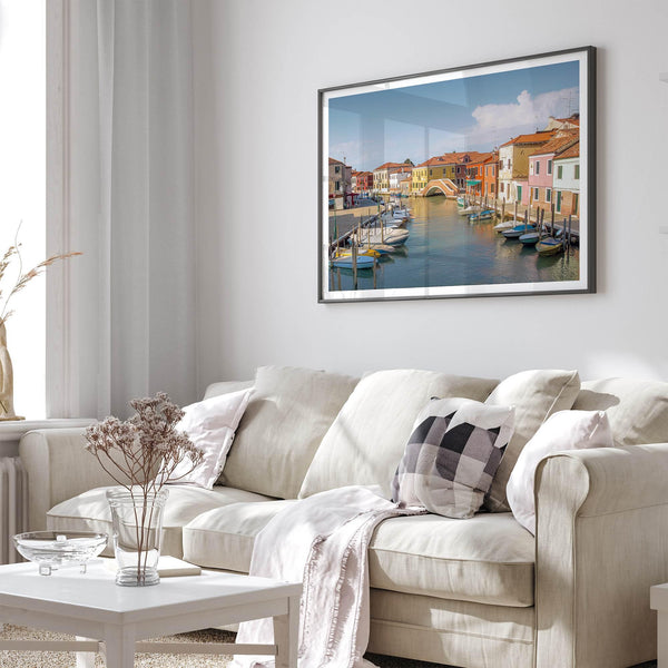 Colorful Murano Venice wall art featuring boats, bridge, and painted homes along the water.
