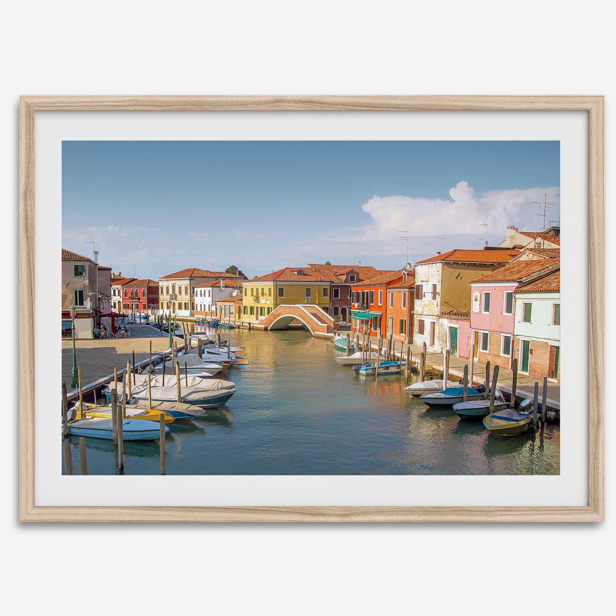 Colorful Murano Venice wall art featuring boats, bridge, and painted homes along the water.