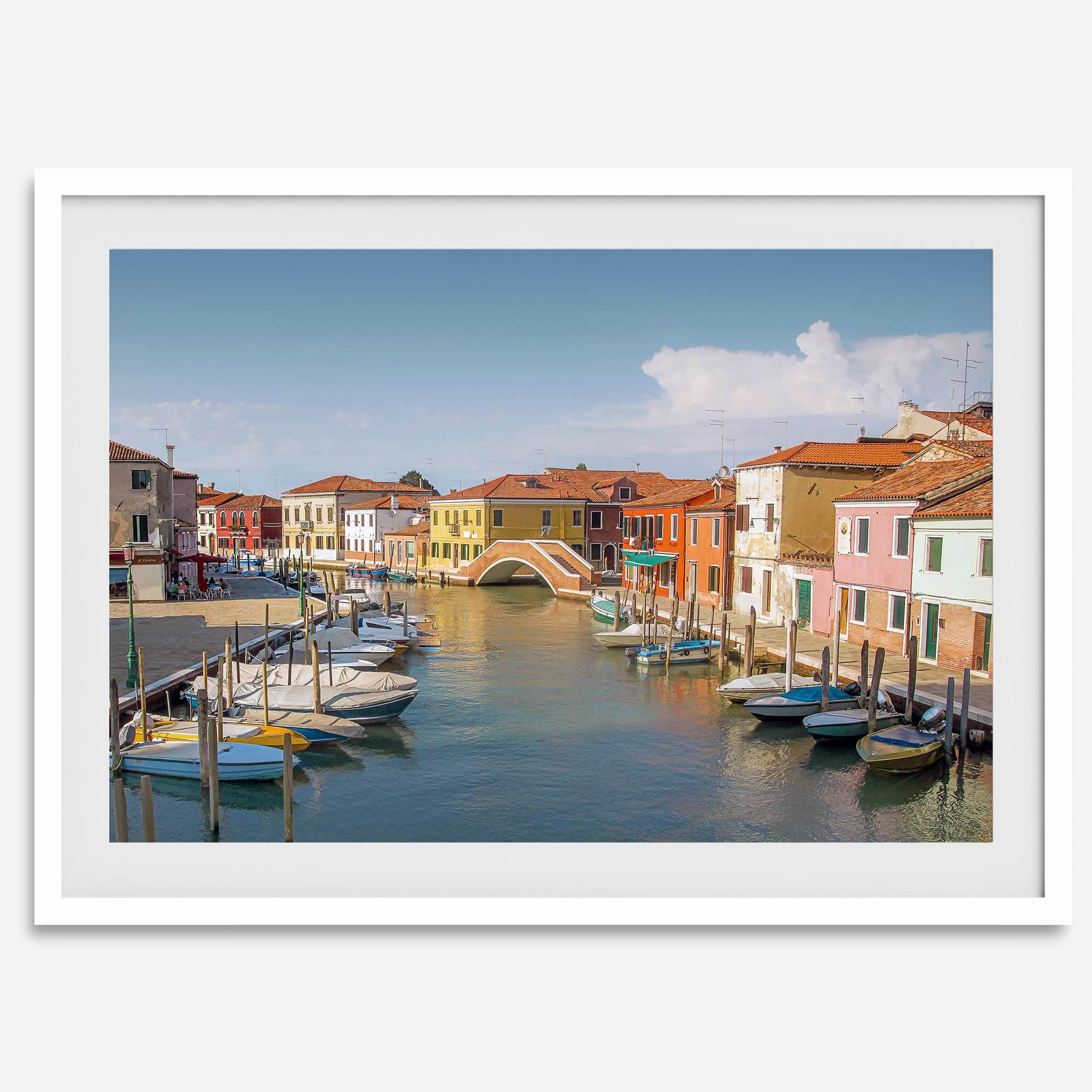 Colorful Murano Venice wall art featuring boats, bridge, and painted homes along the water.