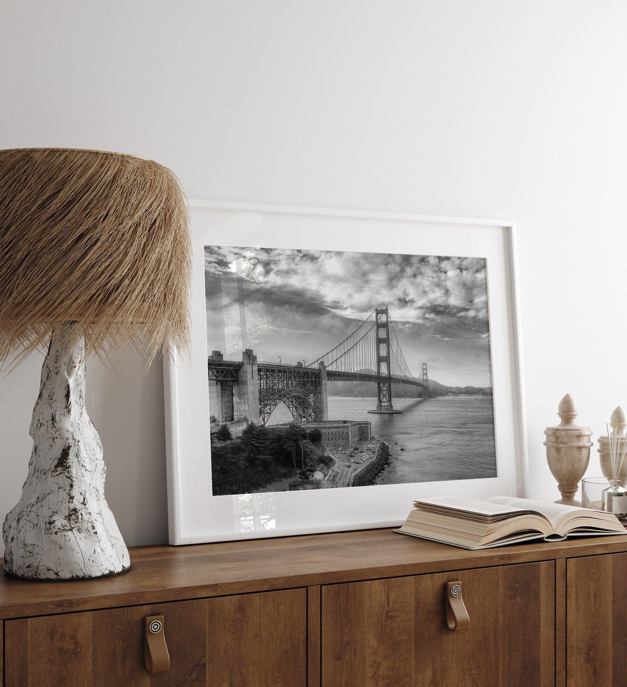 Golden Gate Bridge Wall Art in black-and-white HDR photography with dramatic clouds and water reflections.