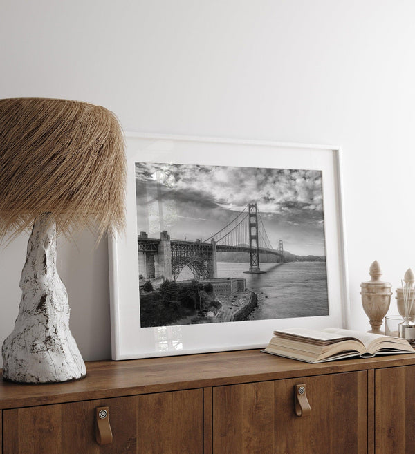 Golden Gate Bridge Wall Art in black-and-white HDR photography with dramatic clouds and water reflections.