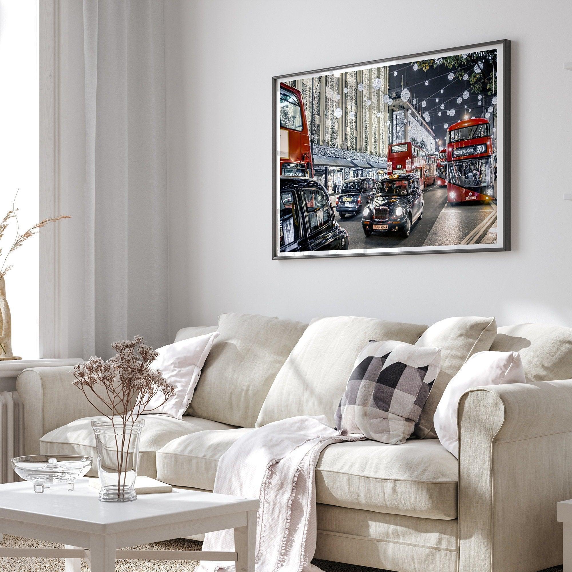 Fine art photography print of a bustling London street during Christmas, featuring double-decker buses, black taxis, and festive holiday lights.