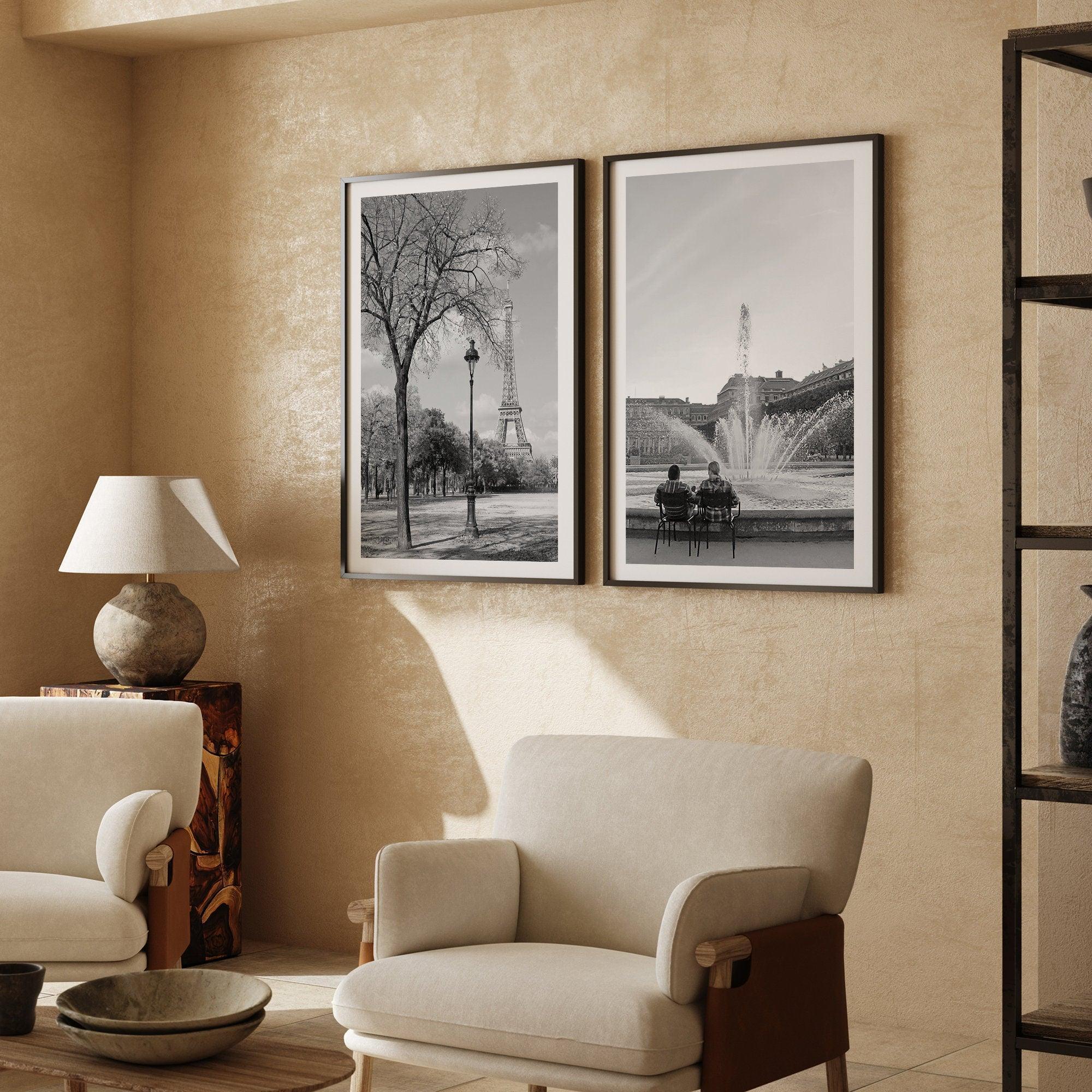 A wall art set of 2 prints from Paris. Left print - Eiffel Tower from Jardin de la Tour Eiffel. Right print - couple sitting in front of the fountain in Palais Royal Garden.