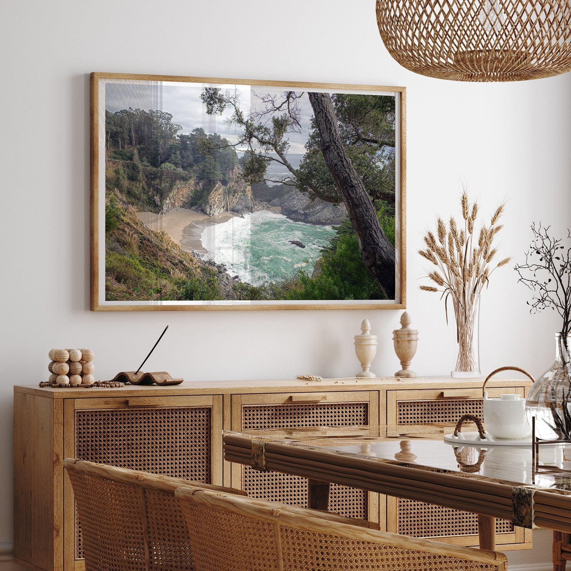 This fine art coastal ocean print features a breathtaking view of Mcway Falls in Big Sur, California, falling to the beach and into the ocean. This fine art photography print captures the beauty and wilderness of nature.