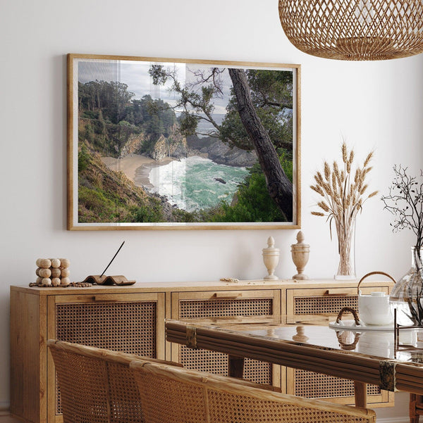 This fine art coastal ocean print features a breathtaking view of Mcway Falls in Big Sur, California, falling to the beach and into the ocean. This fine art photography print captures the beauty and wilderness of nature.